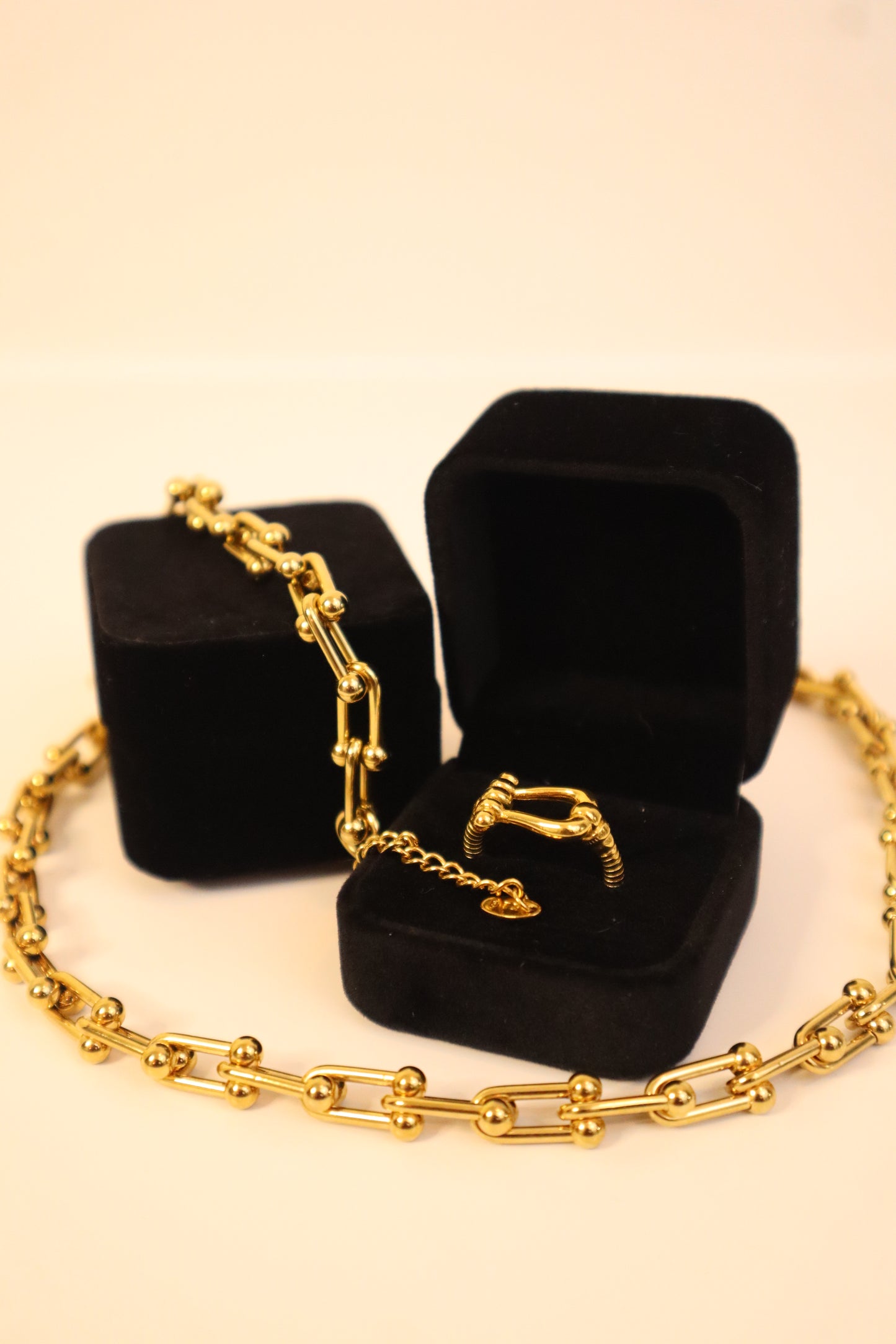 Minimalist 18k gold ring featuring a unique abstract link design—perfect for stacking or wearing solo