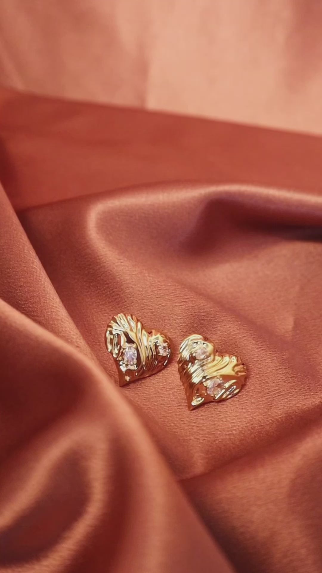 Stylish gold diamond heart statement stud earrings—perfect for making a sophisticated and minimalist statement