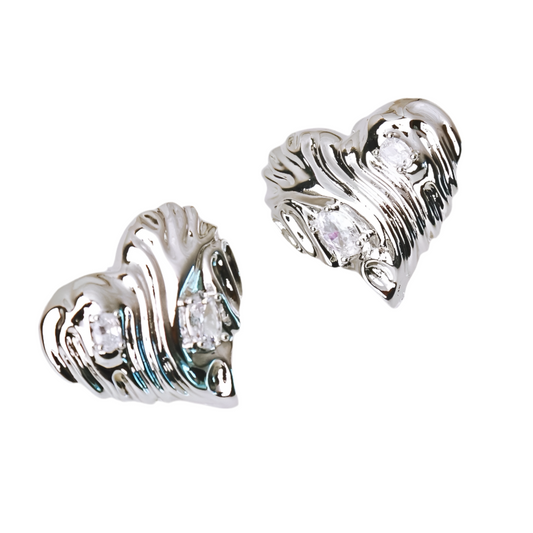 Luxury silver diamond heart statement studs—perfect for adding a bold and chic touch to any outfit.
